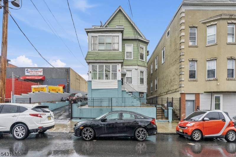 Well maintained multi family property featuring three residential units plus a fully finished walkout basement with additional living space.