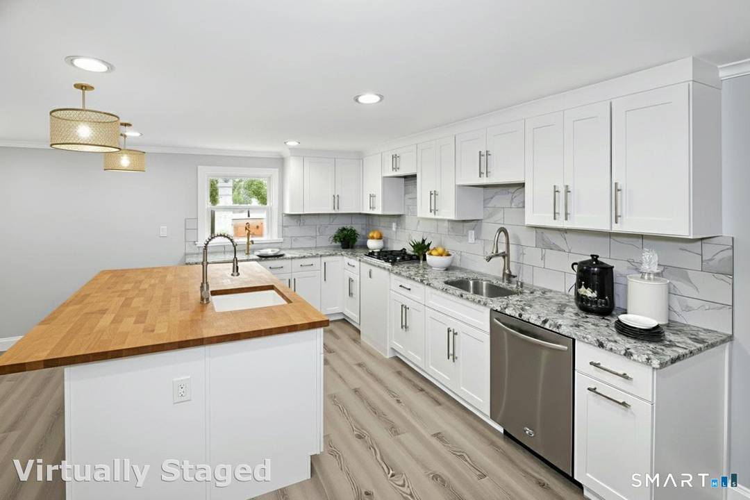 Welcome to this beautifully renovated Cape in the heart of Trumbull.