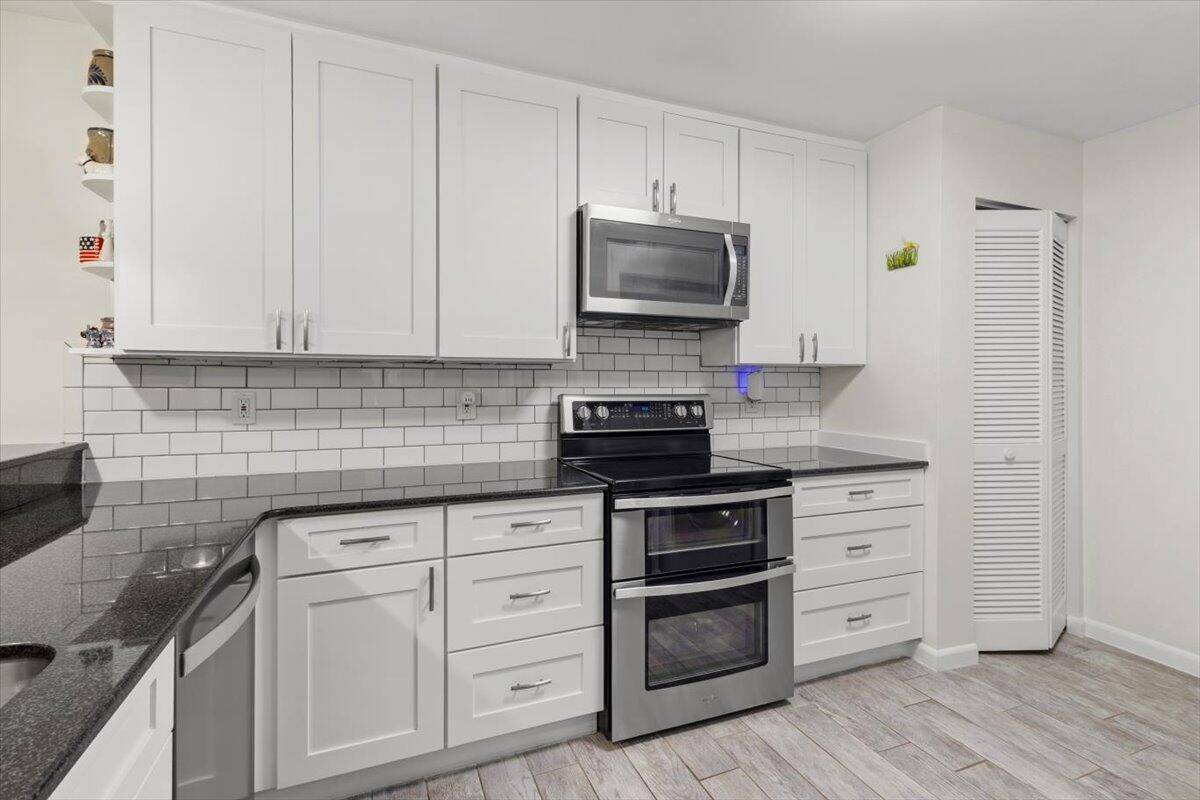 This beautifully updated 2 2 home with a large loft that can easily work as a third bedroom is light, bright and open with wood look tile flooring throughout the ...