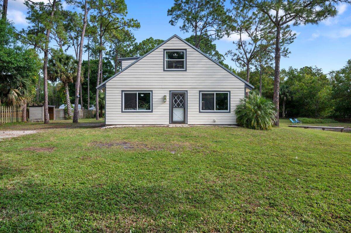 Find the tranquility, wide open spaces, and the peace of mind you have been searching for in this meticulously maintained 3 bedroom, 2 bathroom Jupiter Farms home.