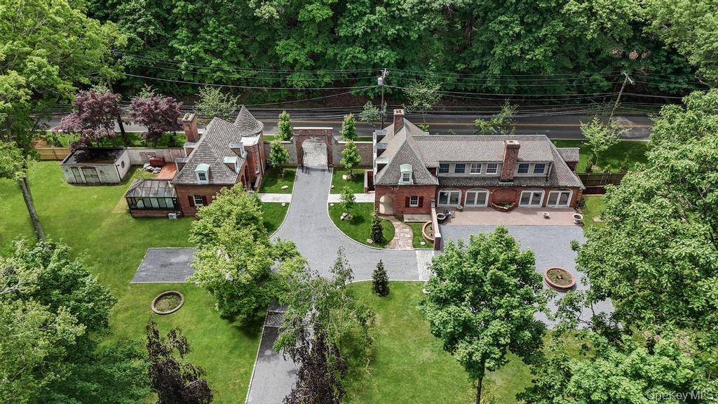 Price Improvement ! Once a stately Carriage House, this reimagined main residence seamlessly blends historic character with modern comfort.