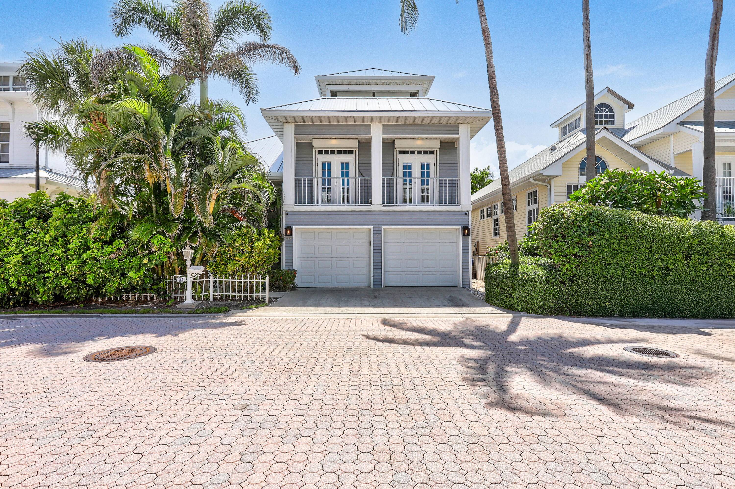 Experience refined coastal living in this stunning Key West style residence, ideally situated within the exclusive gated community of Jupiter Key.