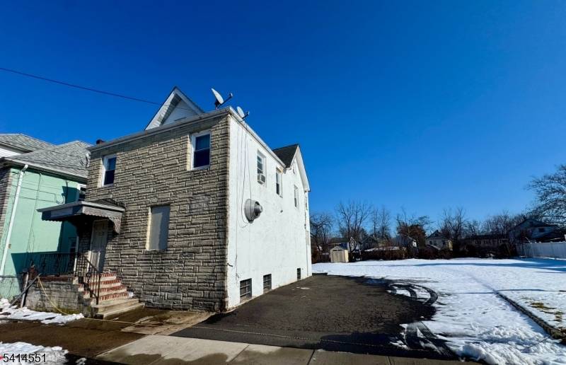 Commercial building located on a double lot in a Residential neighborhood, was utilized as a House of Worship but approved for an Eagles Club.