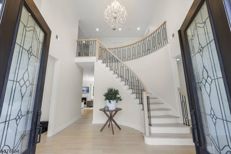 Be prepared to fall in love with this extraordinary 6 bedroom Colonial masterpiece, newly built in 2022, perfectly nestled on a quiet loop road in Summit's most desirable neighborhood.