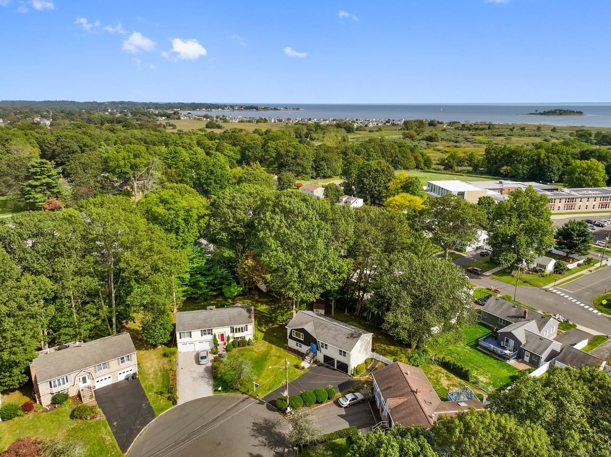 Step into luxury with this stunning raised ranch, nestled in a serene cul de sac between Walnut and Silver Sands Beach.