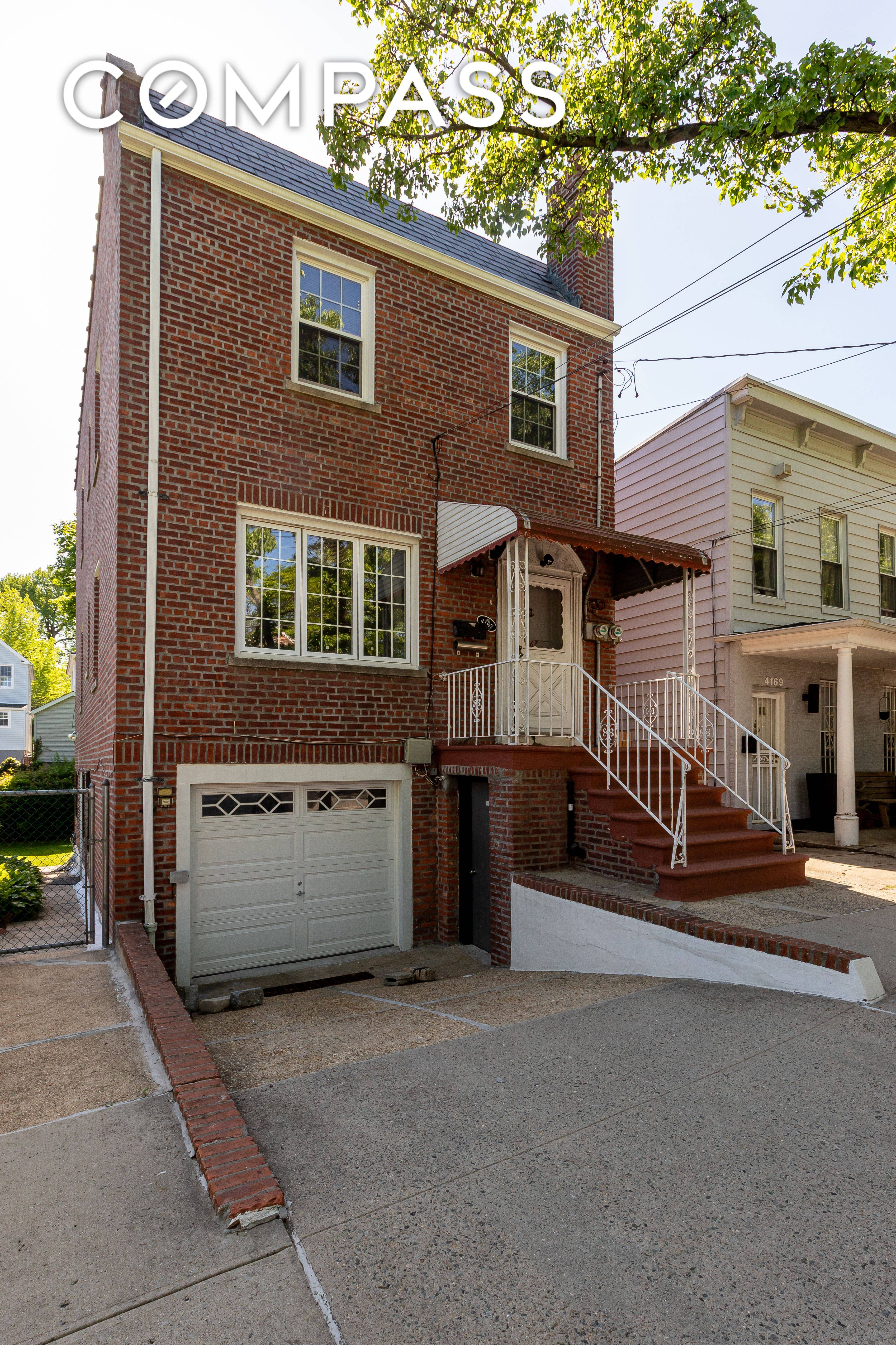 Welcome to 4167 Bruner Avenue A Stylish, Fully Detached Brick Two Family Home with Garage and Expansive Yard !