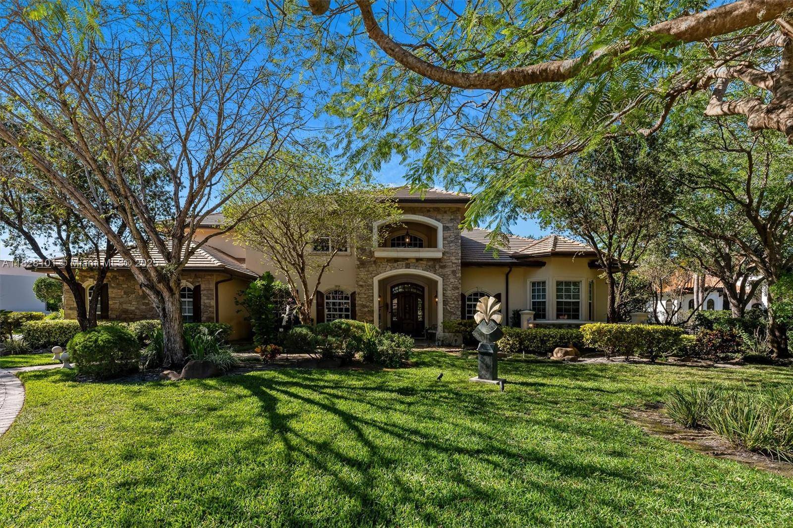 WELCOME TO THE EXCLUSIVE GRAND OAKS COMMUNITY IN DAVIE !