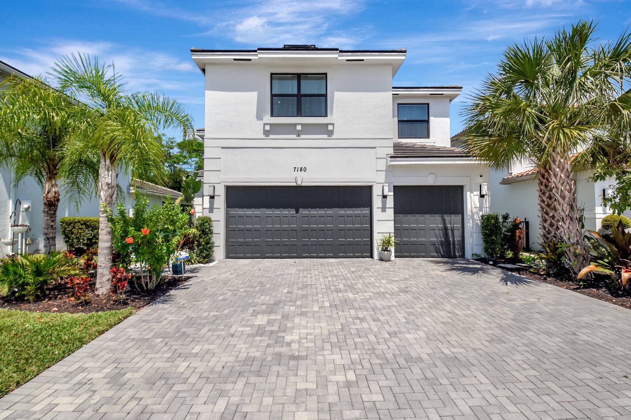 Welcome to 7180 Villamar Way, a beautifully, constructed residence in the sought after gated community of Toscana Isles in Lake Worth.