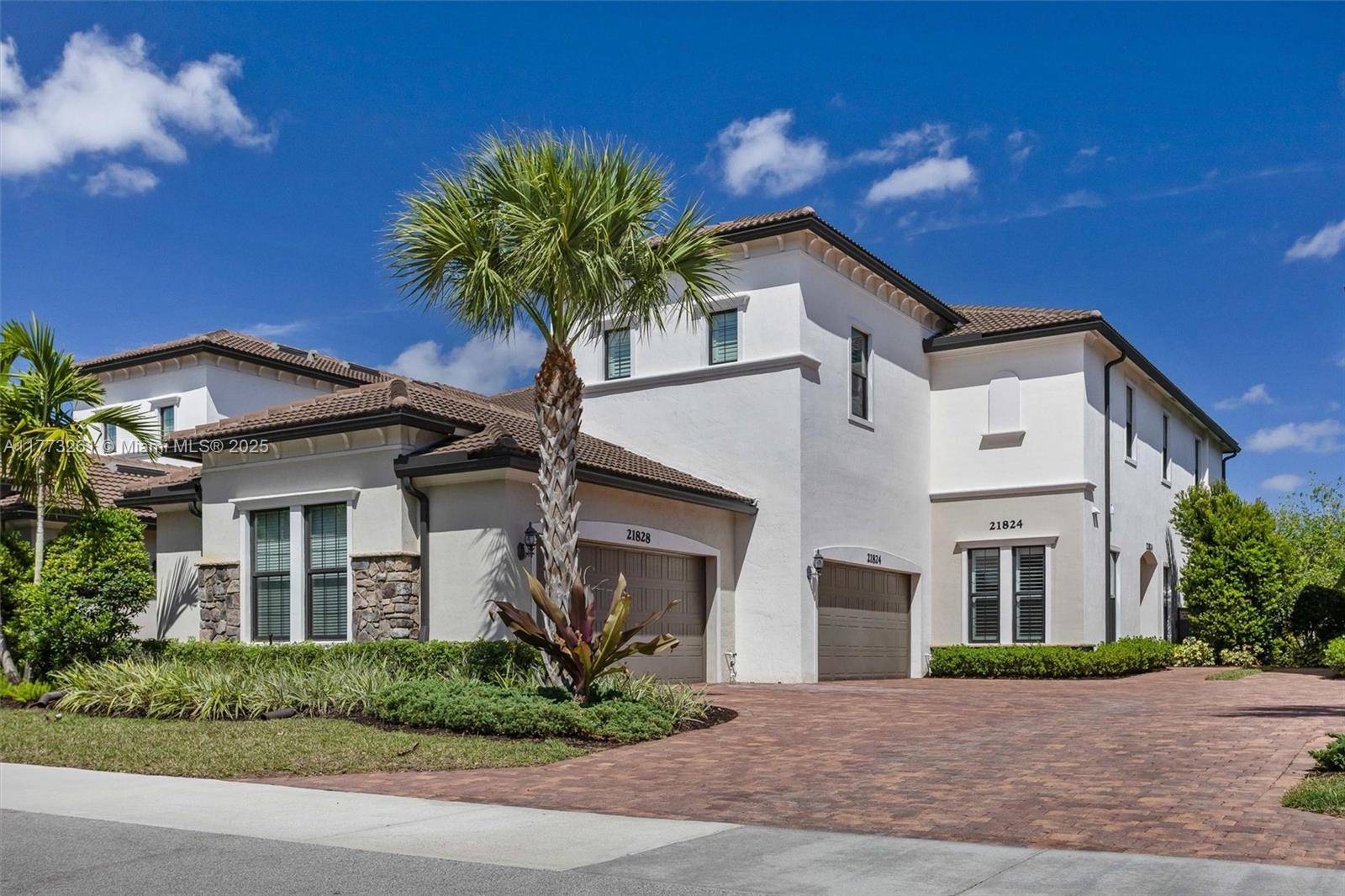 Immaculate 2 bedroom, 2 bath home with an office den, two car garage, and screened patio located on the water in a gated Central Boca Raton community.