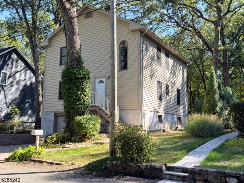 Welcome to this beautifully maintained custom home nestled in the desirable Rainbow Lakes community.