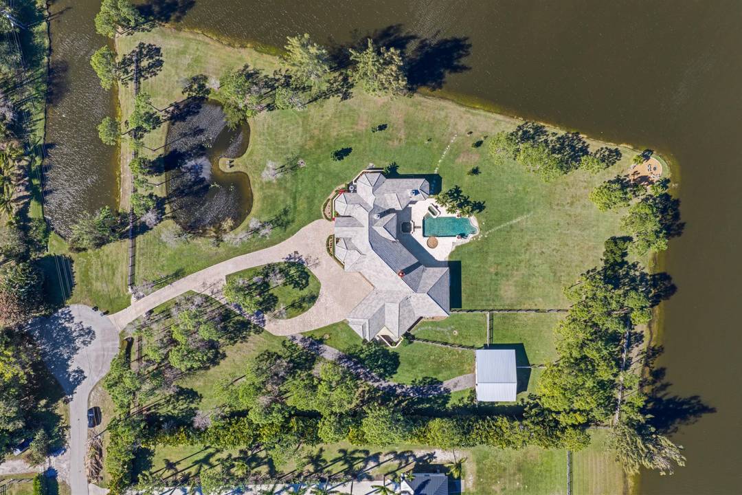 MULTI USE, PRISTINE 5 ACRE POINT LOT surrounded by water, offering exceptional privacy and serene natural beauty.