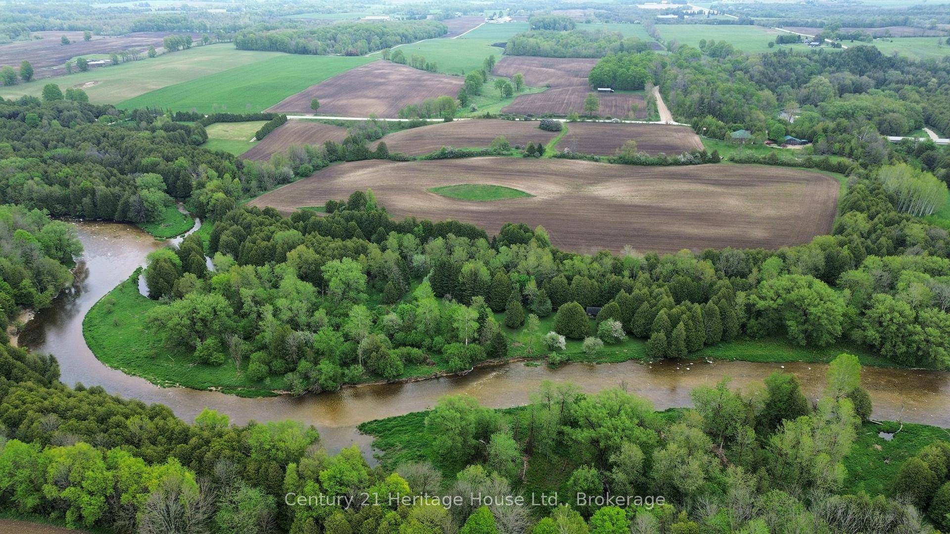 This Rare 50 acre parcel just outside of Mount Forest offers breathtaking views and a river that runs through the land !