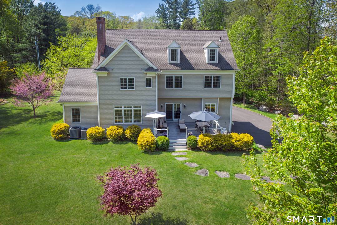 Set on 1. 82 private acres, this turn key Colonial seamlessly blends timeless architecture w refined transitional design exceptional craftsmanship.