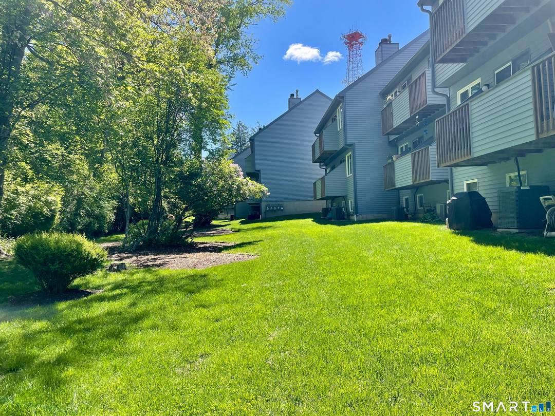 Pristine townhouse nestled in a small, well maintained complex in Norwalk.