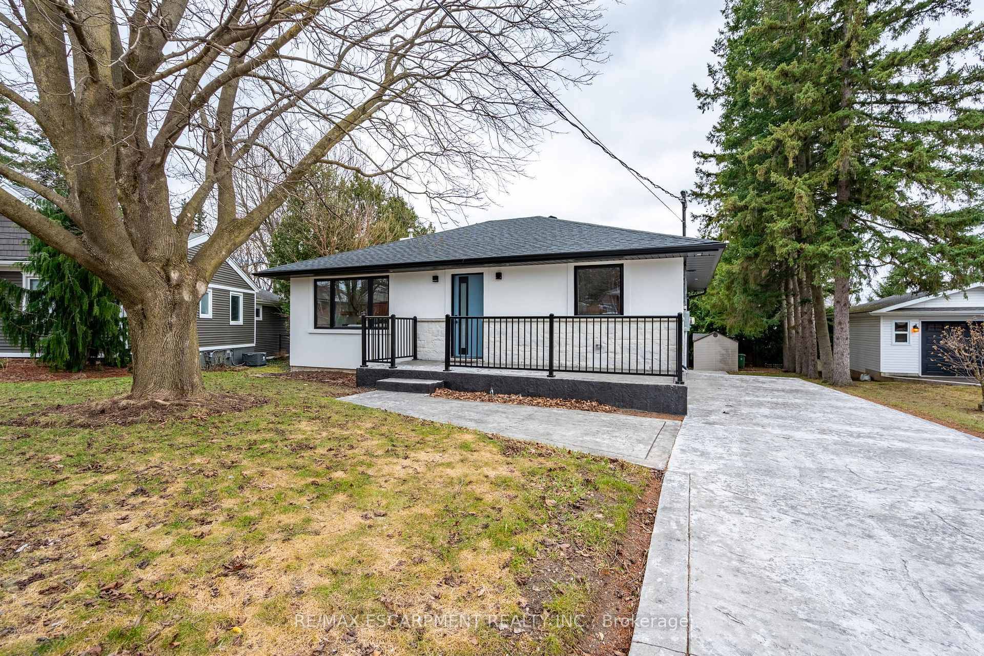 Welcome to this exquisite bungalow nestled on a serene, tree lined lot, offering a perfect blend of luxury and tranquility in Waterdown, Ontario.