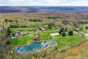 Impeccably designed for the modern sophisticate, the enchanting country estate at Maple Hill is a serenely private retreat on over 40 acres, just 1 hour from New York City.