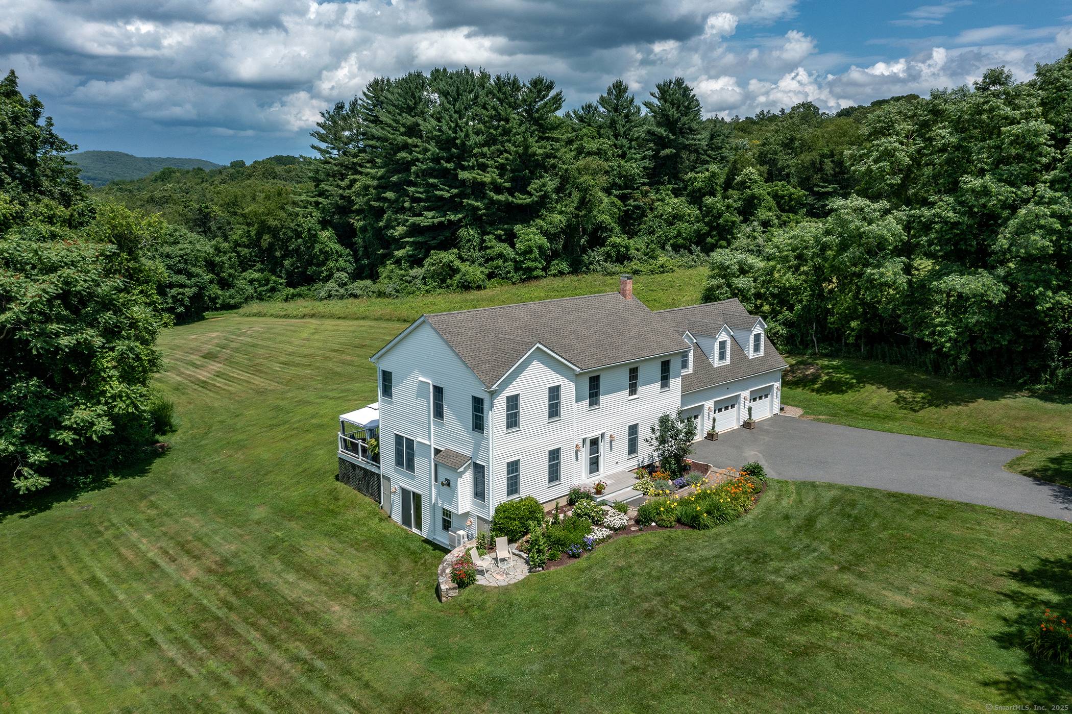 Beautifully maintained Colonial set on over three acres of rolling lawn and mature landscaping in scenic Washington, CT.