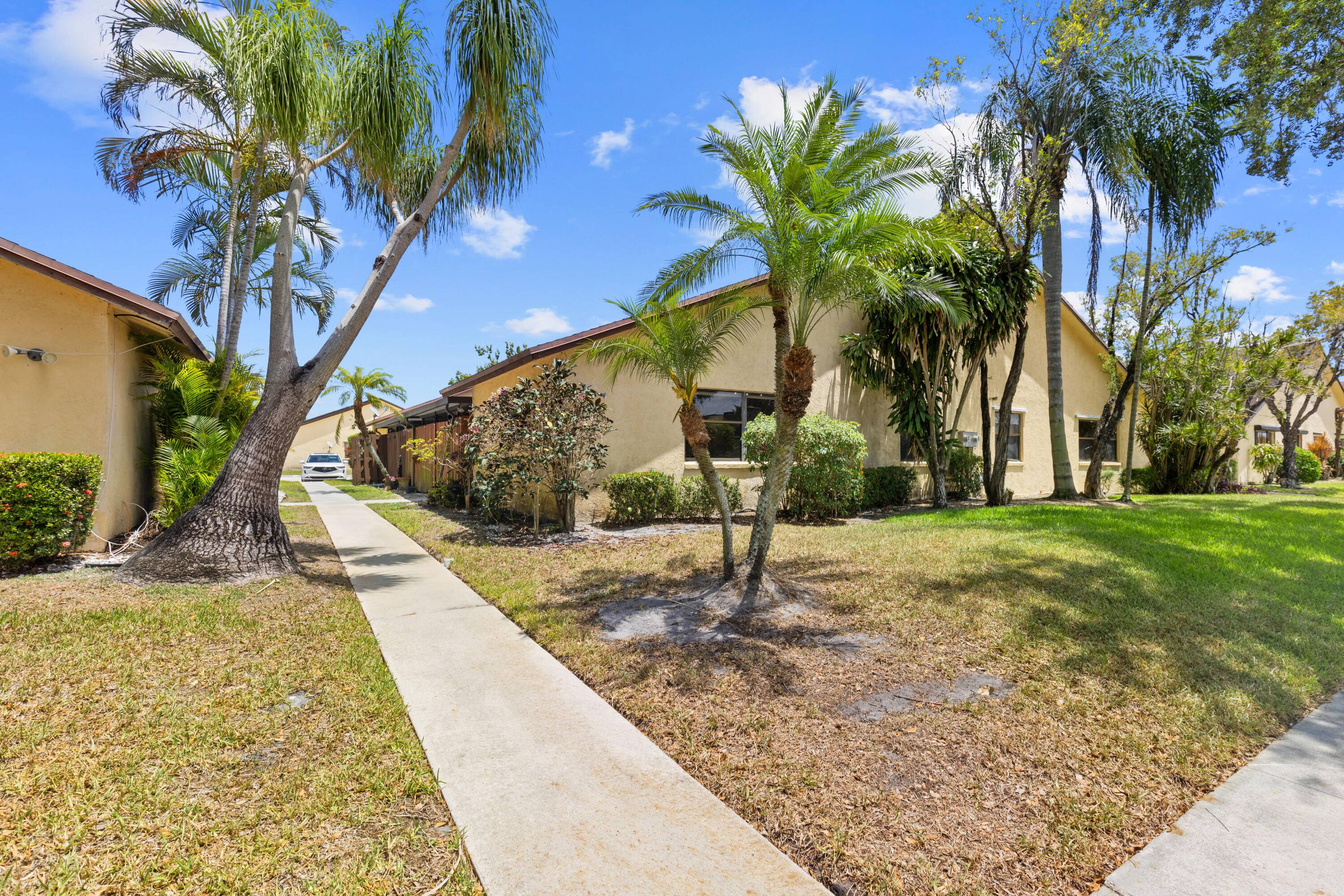 Step into comfort and style with this updated 2 bedroom, 2 bathroom home featuring a screened covered front patio, complete with a ceiling fan wall mounted TV perfect for relaxing ...