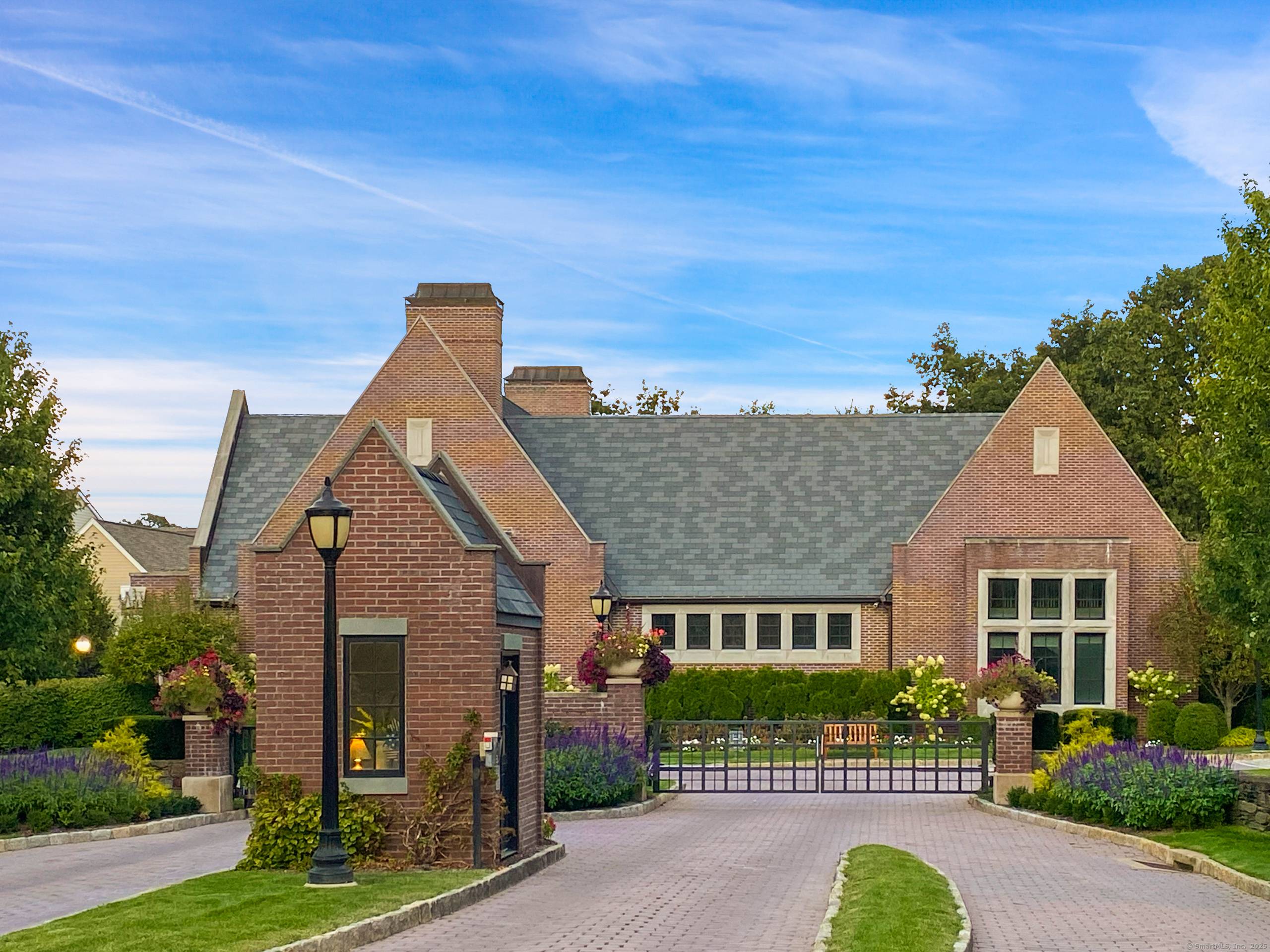 Charming window boxes span the upper level while a covered entrance with easy access welcomes you to this stunning end unit townhome in the highly coveted Palmer Hill Association, a ...