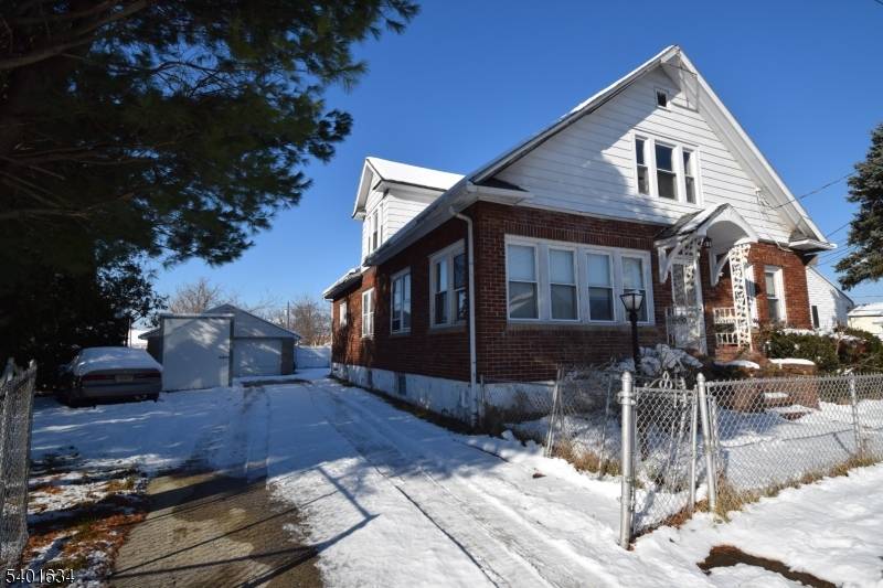 Don't miss this opportunity to renovate this 2 family home with a 2 car garage on an oversized lot that's not in a flood zone.