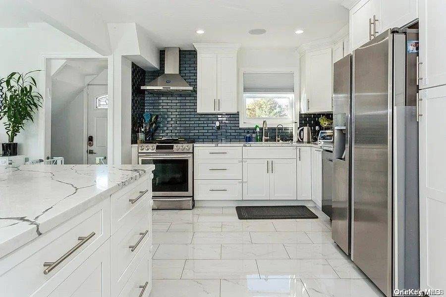 Two family luxury with rental income potential in the beautiful Gibson neighborhood this fully renovated Valley Stream home combines modern elegance with smart investment value.