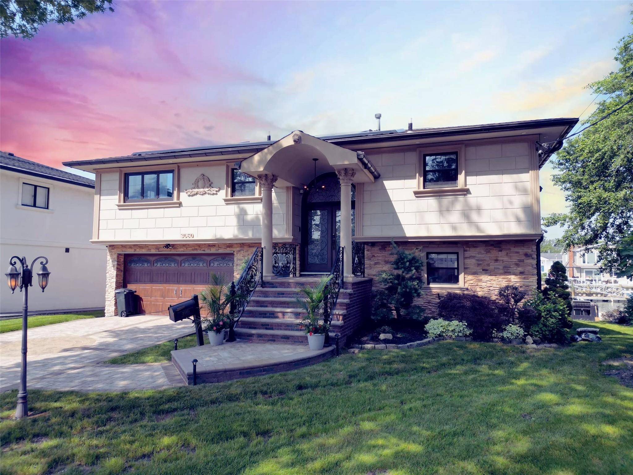Tucked away on a quiet cul de sac in Baldwin Harbor, this exquisite waterfront residence offers a rare blend of elegance, comfort, and modern innovation.