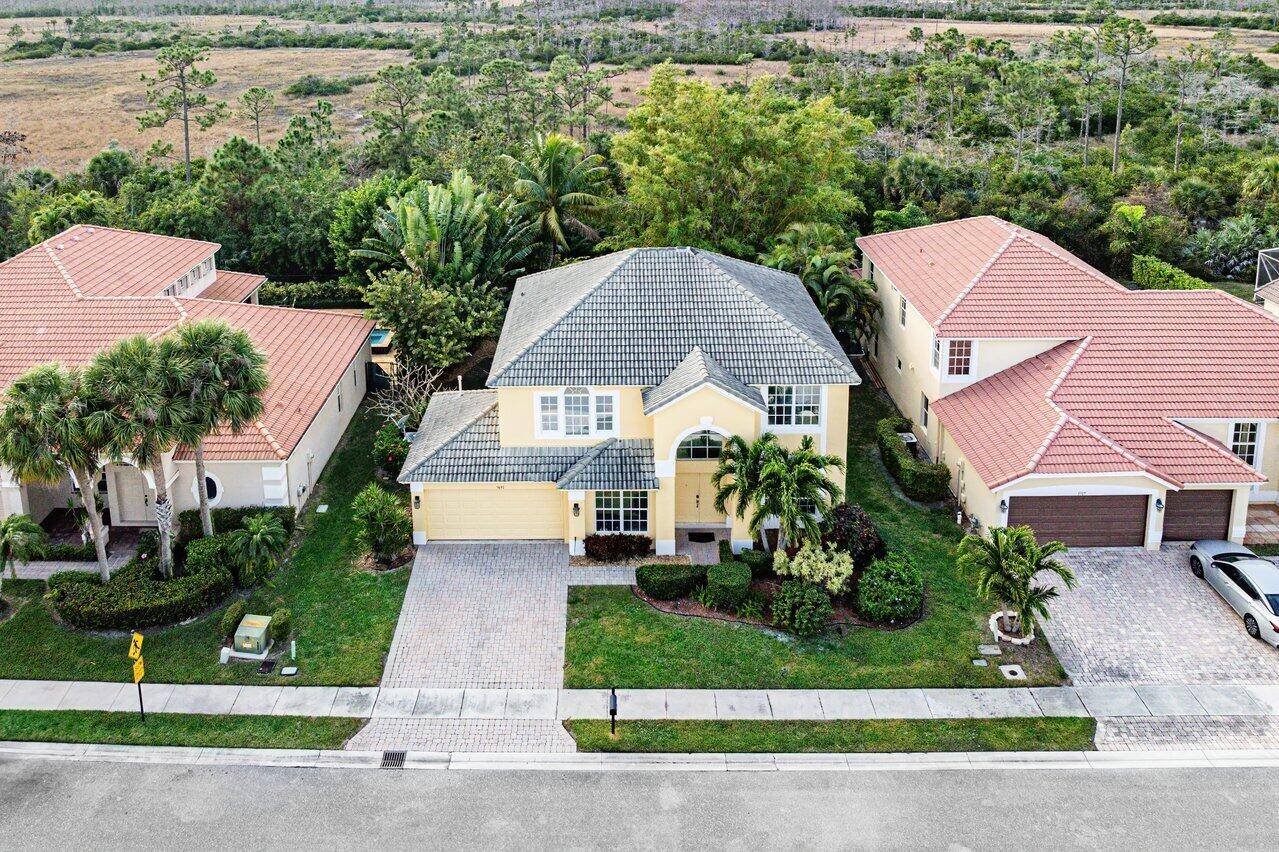 Welcome to this stunning 5 bedroom loft, 3 bathroom, 2 car garage single family home in the highly sought after gated community of Hamilton Bay.