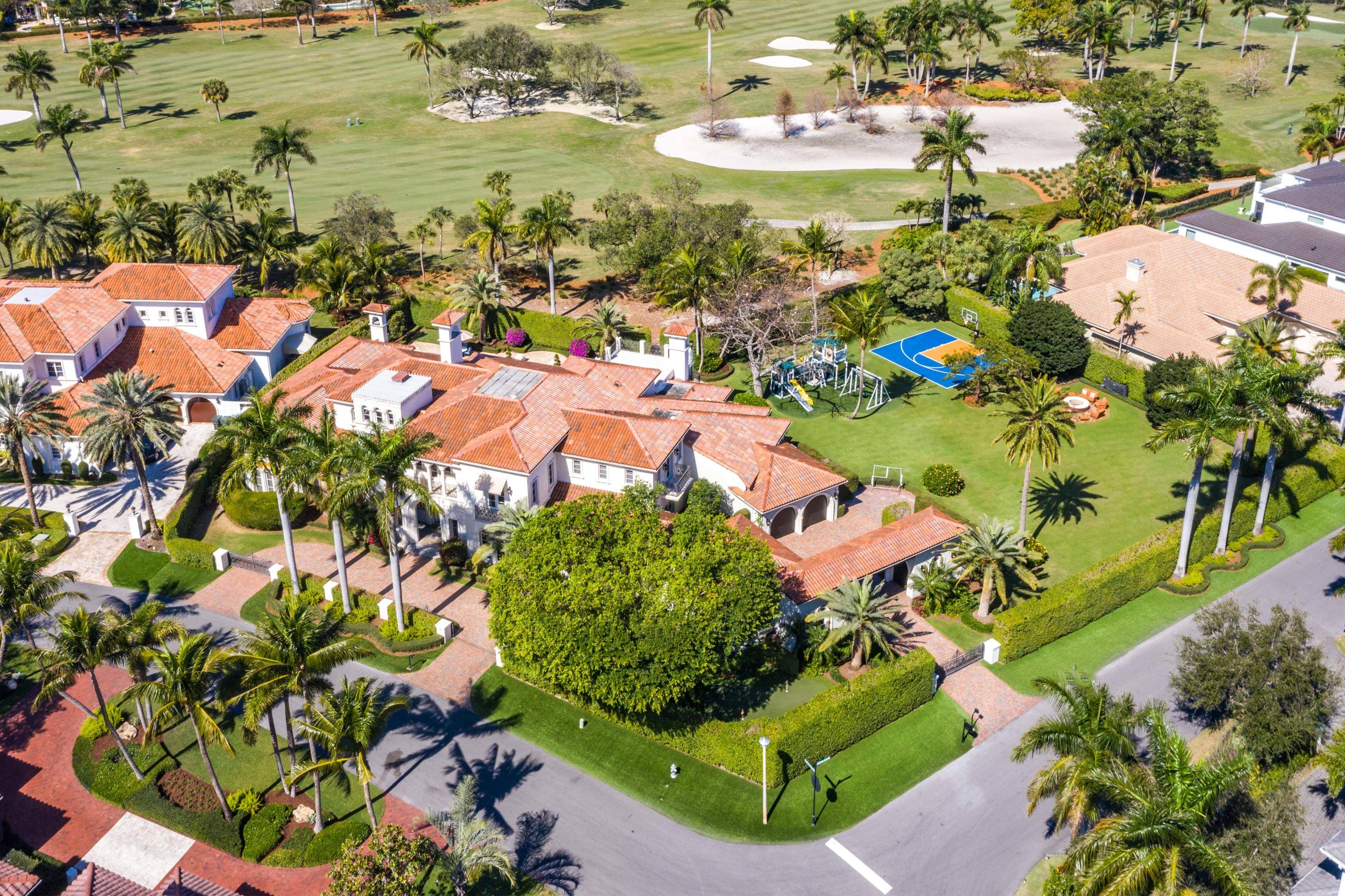 A rare opportunity to own nearly an acre of land on the golf course in Royal Palm Yacht Country Club complete with a sports court.