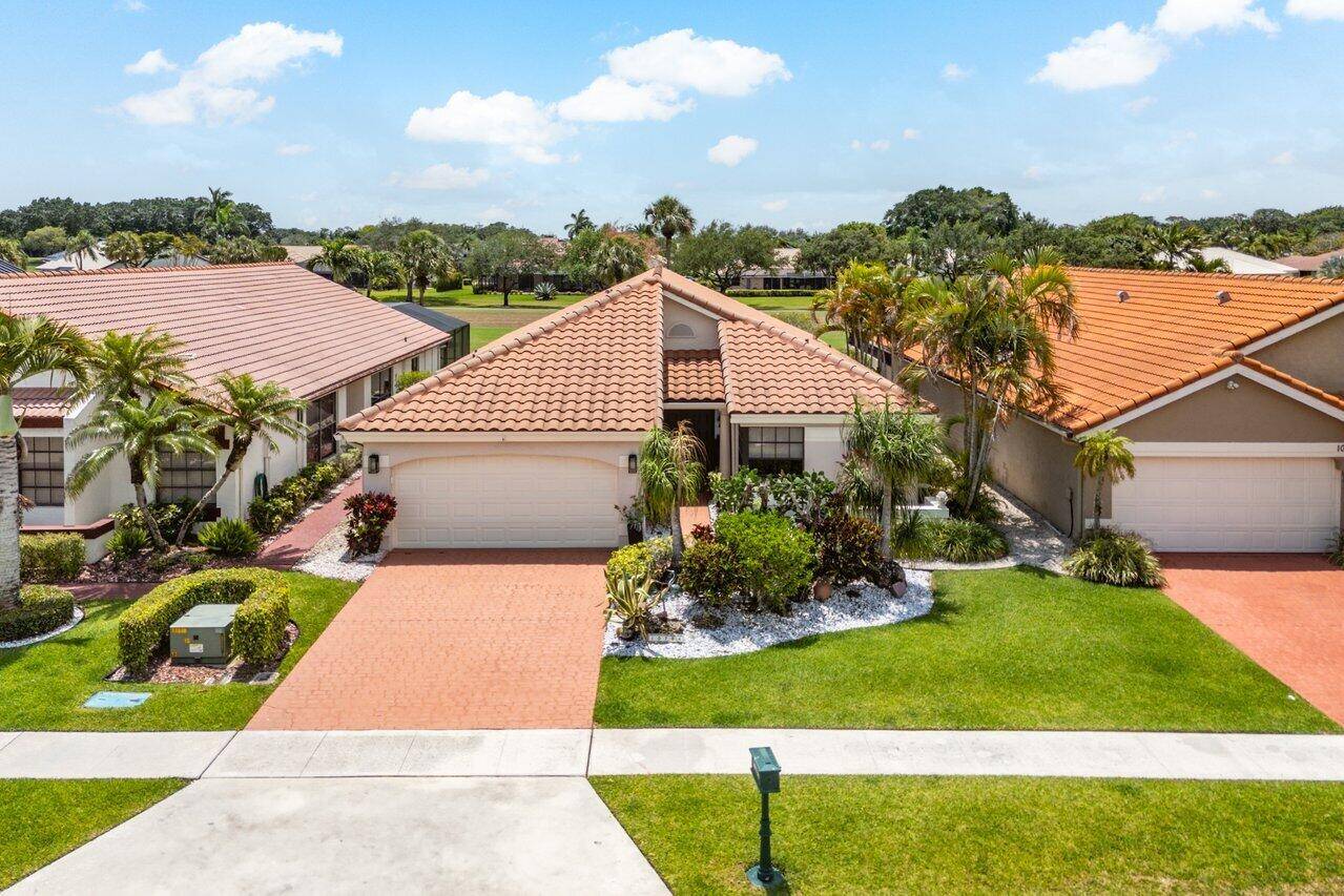 Located in the highly sought after Boca Woods Country Club, this 3 bed 2 bath home is tucked away on a quiet cul de sac street.