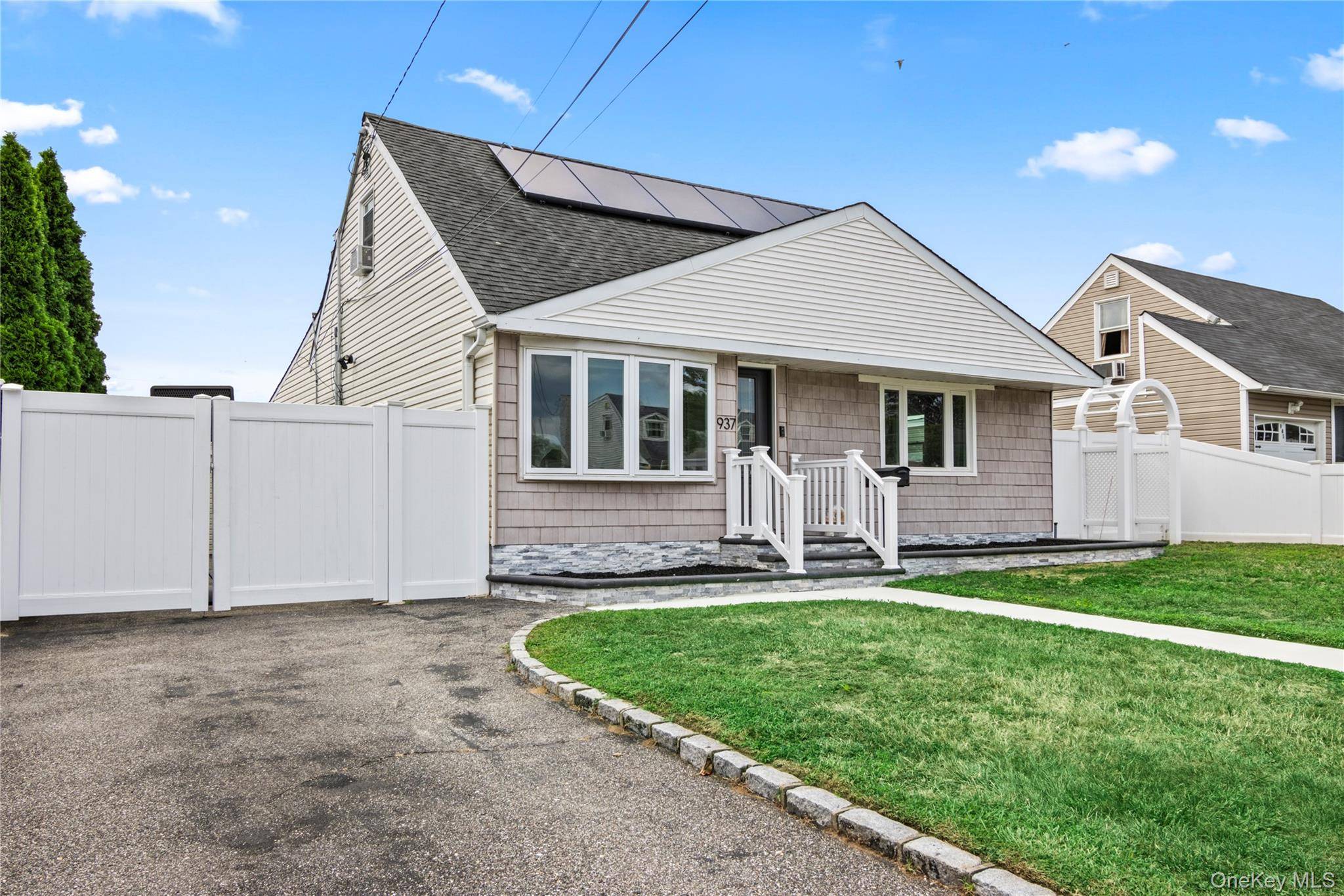 This updated Cape style home is situated in the East Meadow School District, offering a spacious and functional layout.