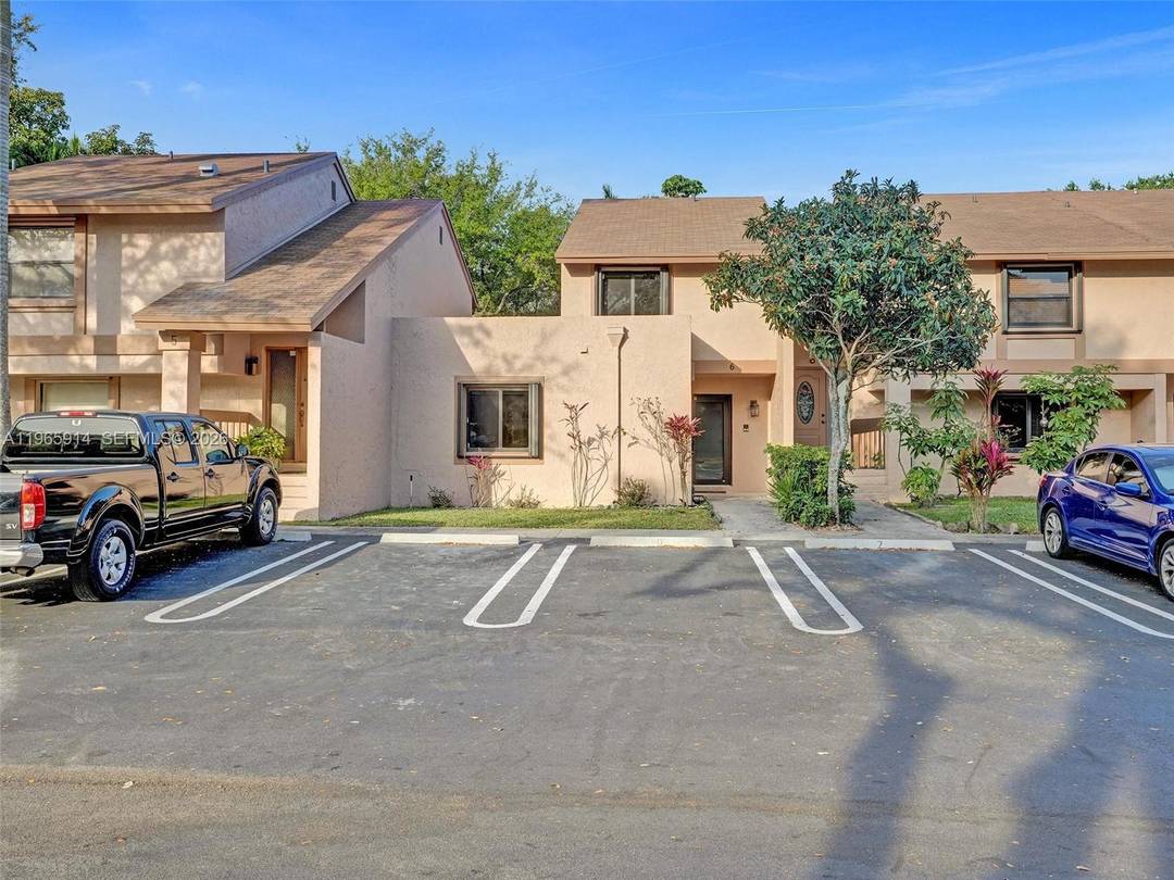 Cooper City 3BD 2BA townhome for sale with impact windows and a newer roof.