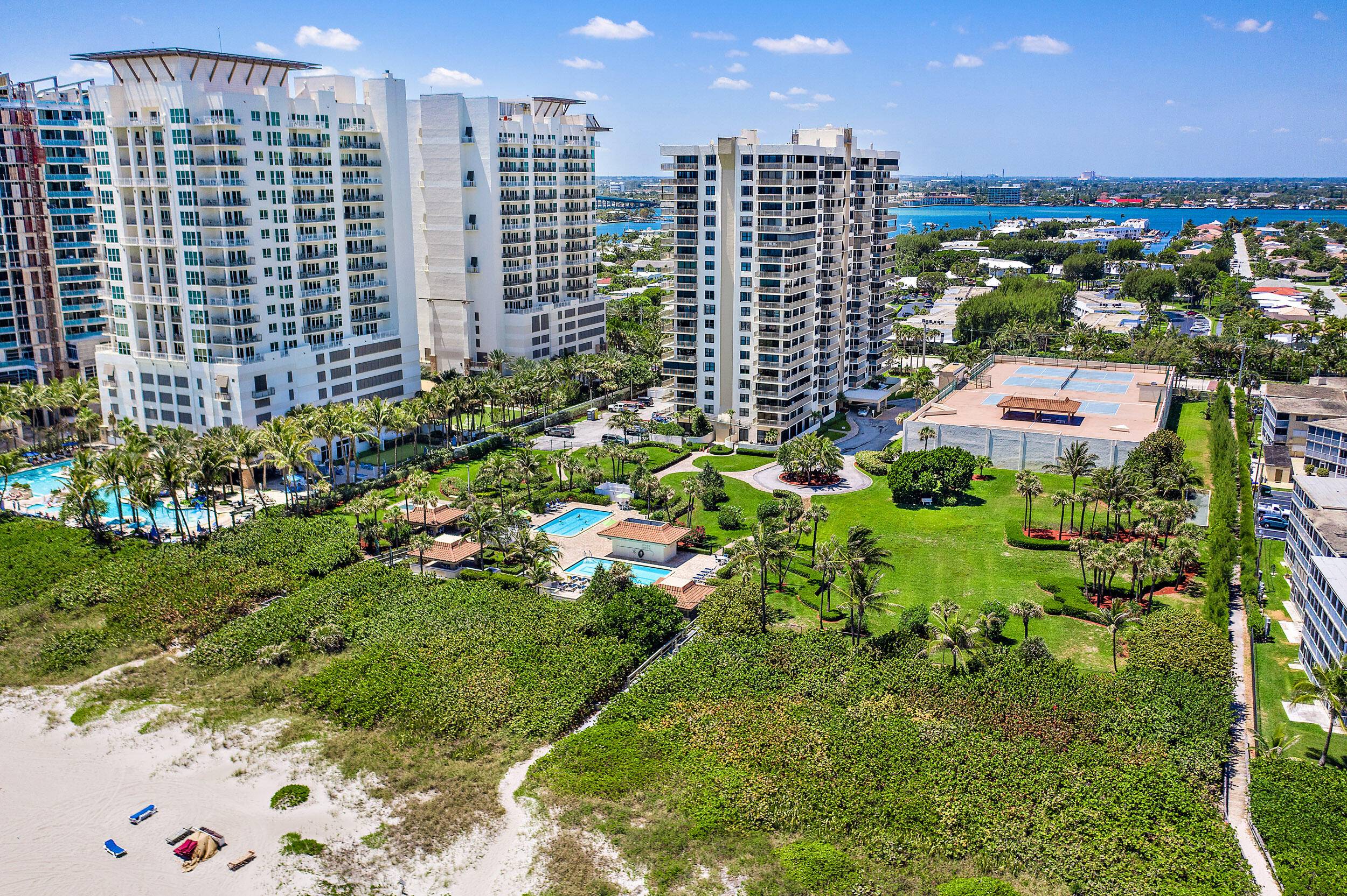 Spacious 2 2 corner over 1, 500 SF with water view and HUGE wraparound balcony, light and bright, large open rooms, updated appliances, walk in closets, Roman tub, walk in ...