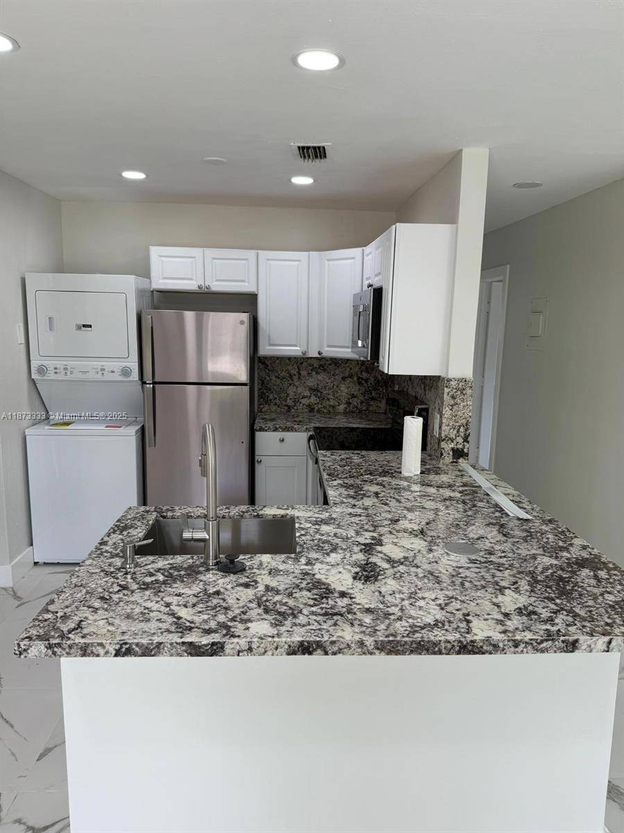 STUNNING, fully renovated 5 bedroom 2 bathroom home with huge private backyard.