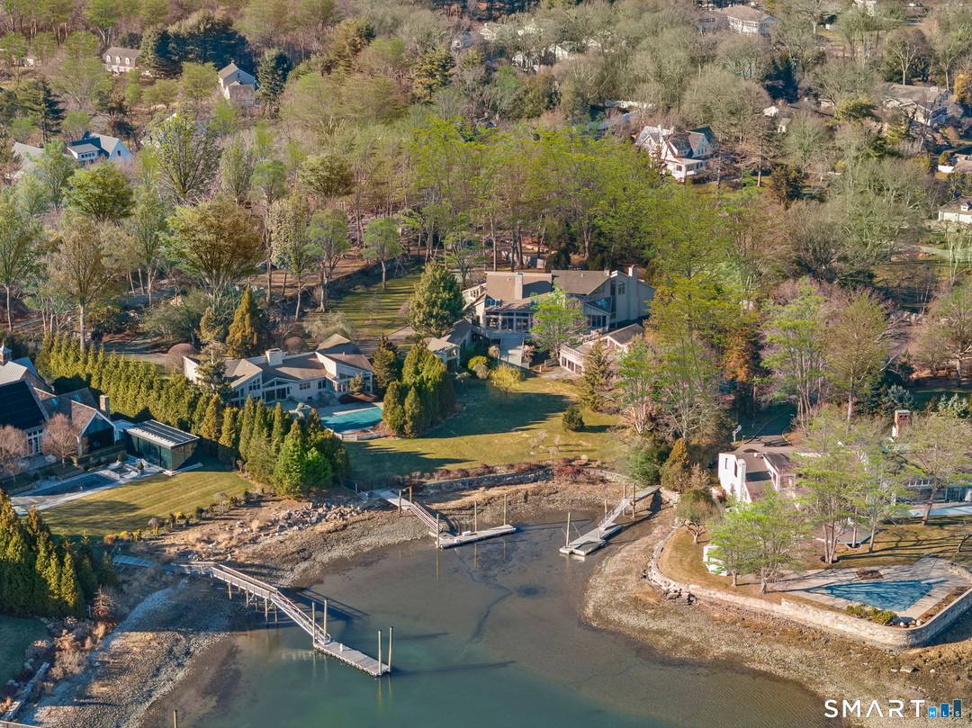 Set on over 3 private acres with sweeping water views, 2 Judy Point Lane is a remarkable Westport waterfront estate offering approximately 14, 000 square feet of living space and ...