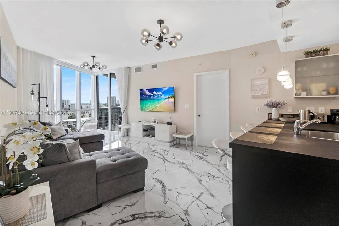 Live the oceanfront lifestyle in this beautifully renovated 1BR 1.