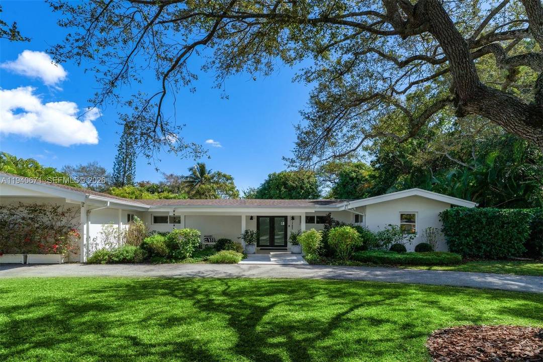 Set on a spacious half acre lot in Pinecrest, this light filled 5BD 3BA single story home offers privacy, comfort and seamless indoor outdoor areas for play and relaxation.