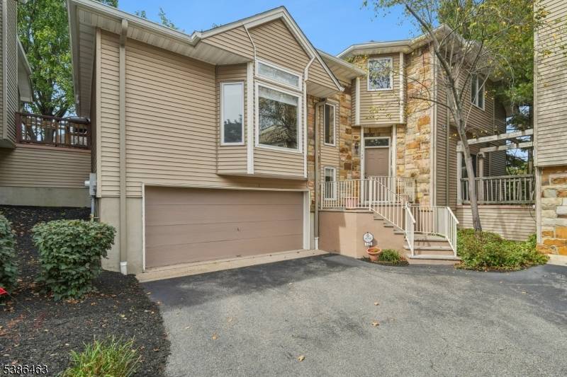 Welcome to this spacious and elegant townhouse in the prestigious Crystal Woods community of West Orange, NJ.