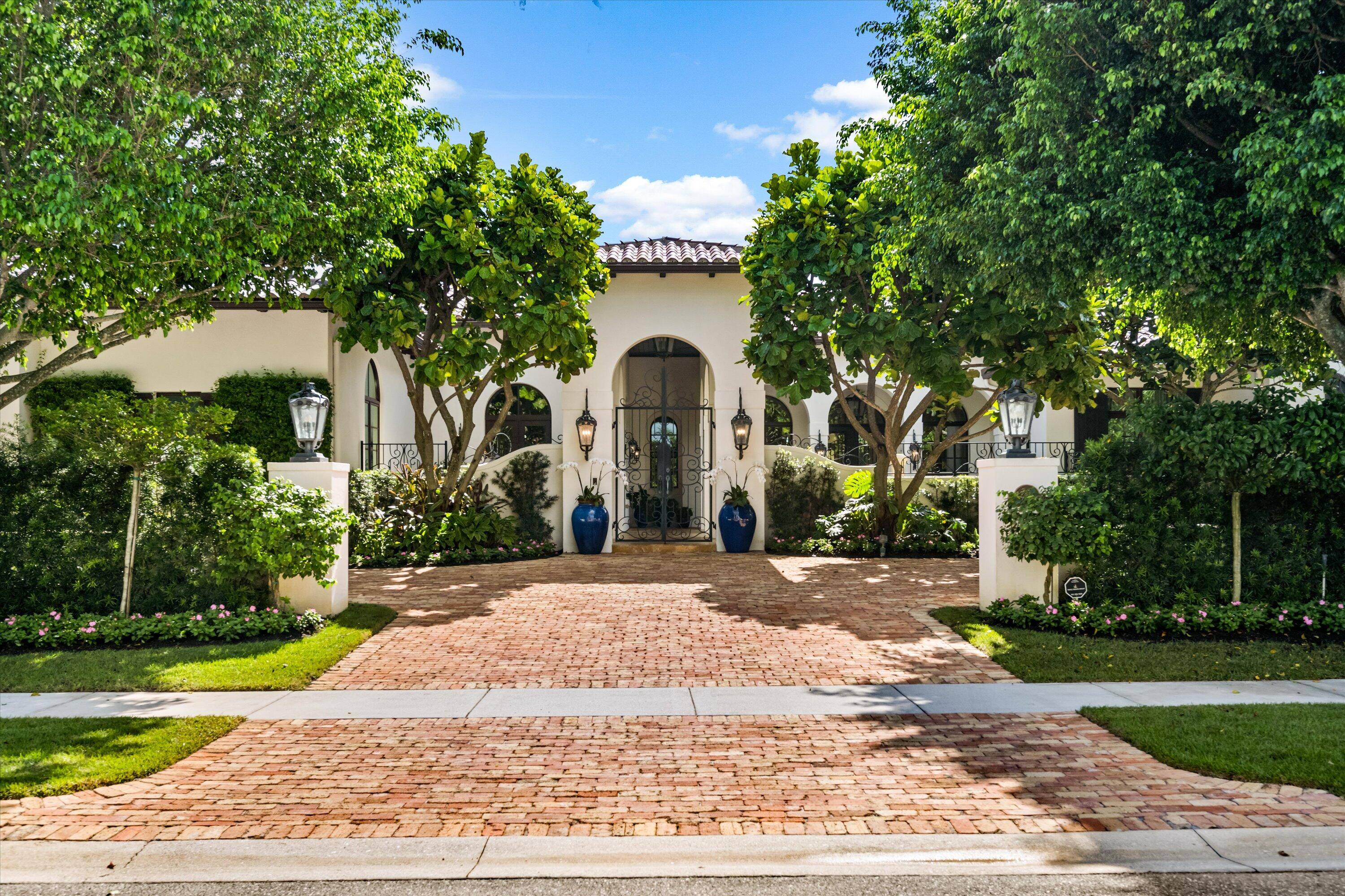 Exuding sophistication and timeless appeal, this stunning Cypress Island estate epitomizes luxury living within the prestigious Palm Beach Polo Golf and Country Club.