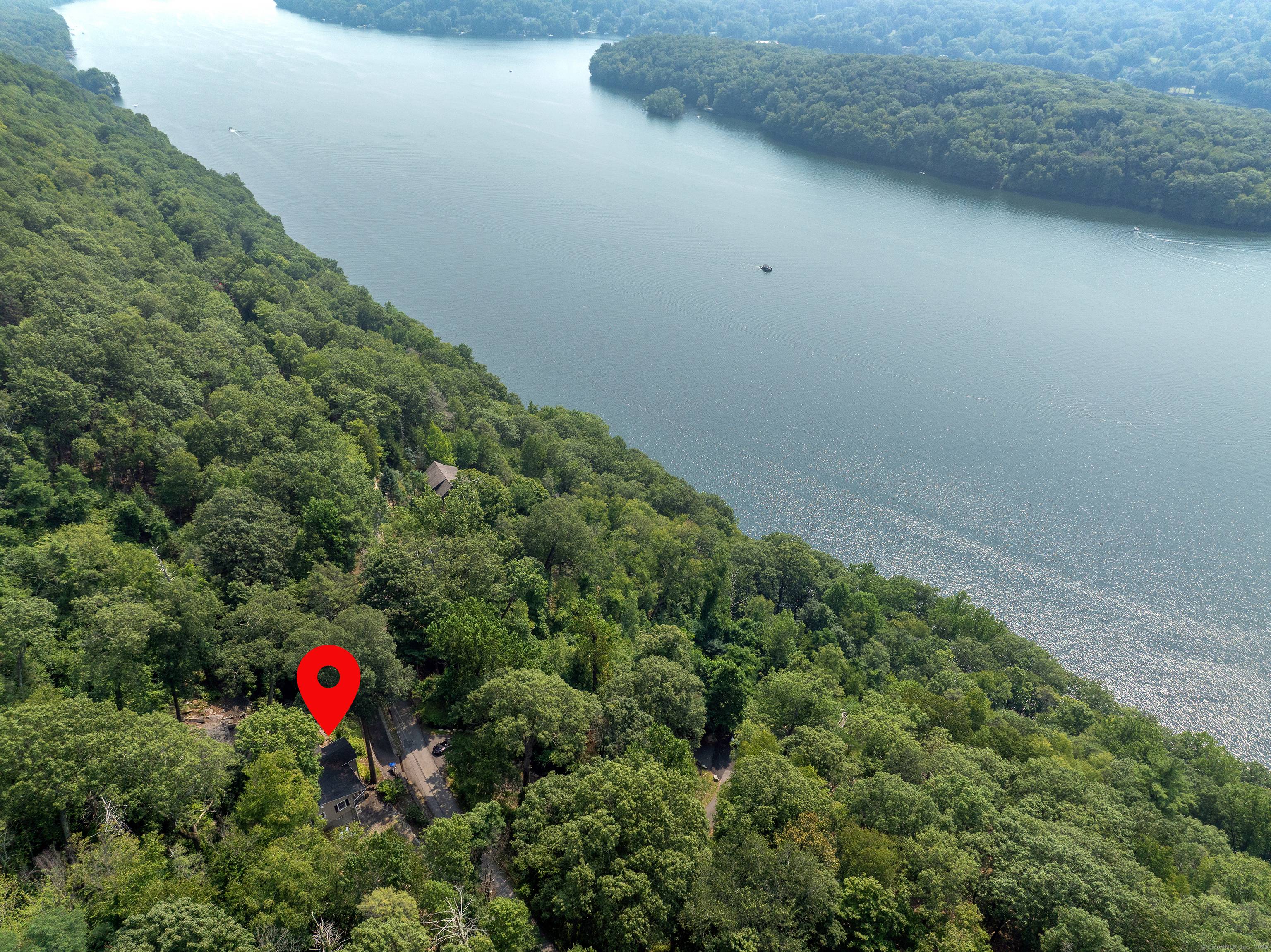 Happy Hill in Candlewood Lake Estates Discover lake community living and the feeling of being on vacation year round in this private, gated community featuring four residents only beaches.