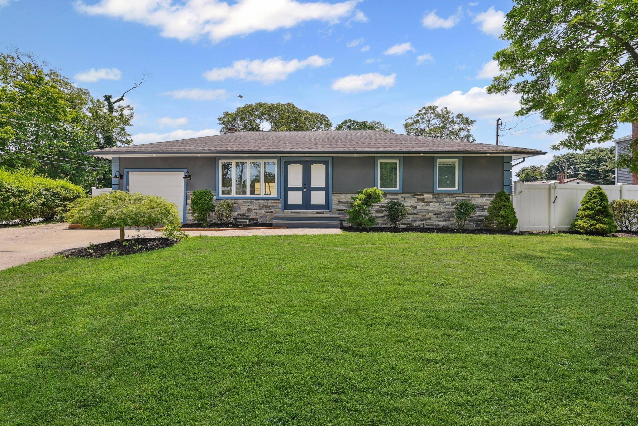 Welcome to This Beautifully Renovated 4 Bedroom, 2 Full Bathroom Ranch Perfectly Situated on a Desirable Corner Property, Offering The Perfect Blend of Comfort, Light and Livability.