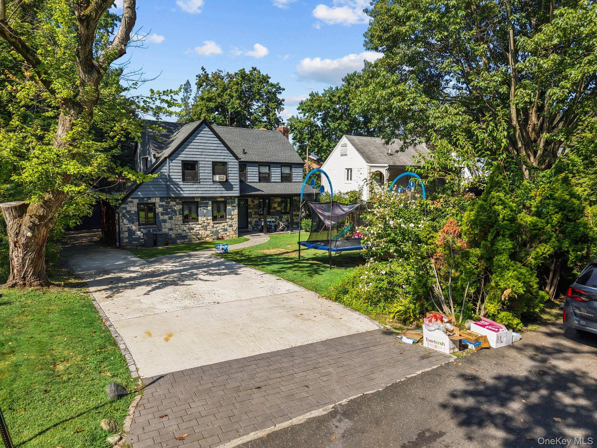 Welcome to this beautifully renovated, sun drenched home on a quiet, tree lined residential street.