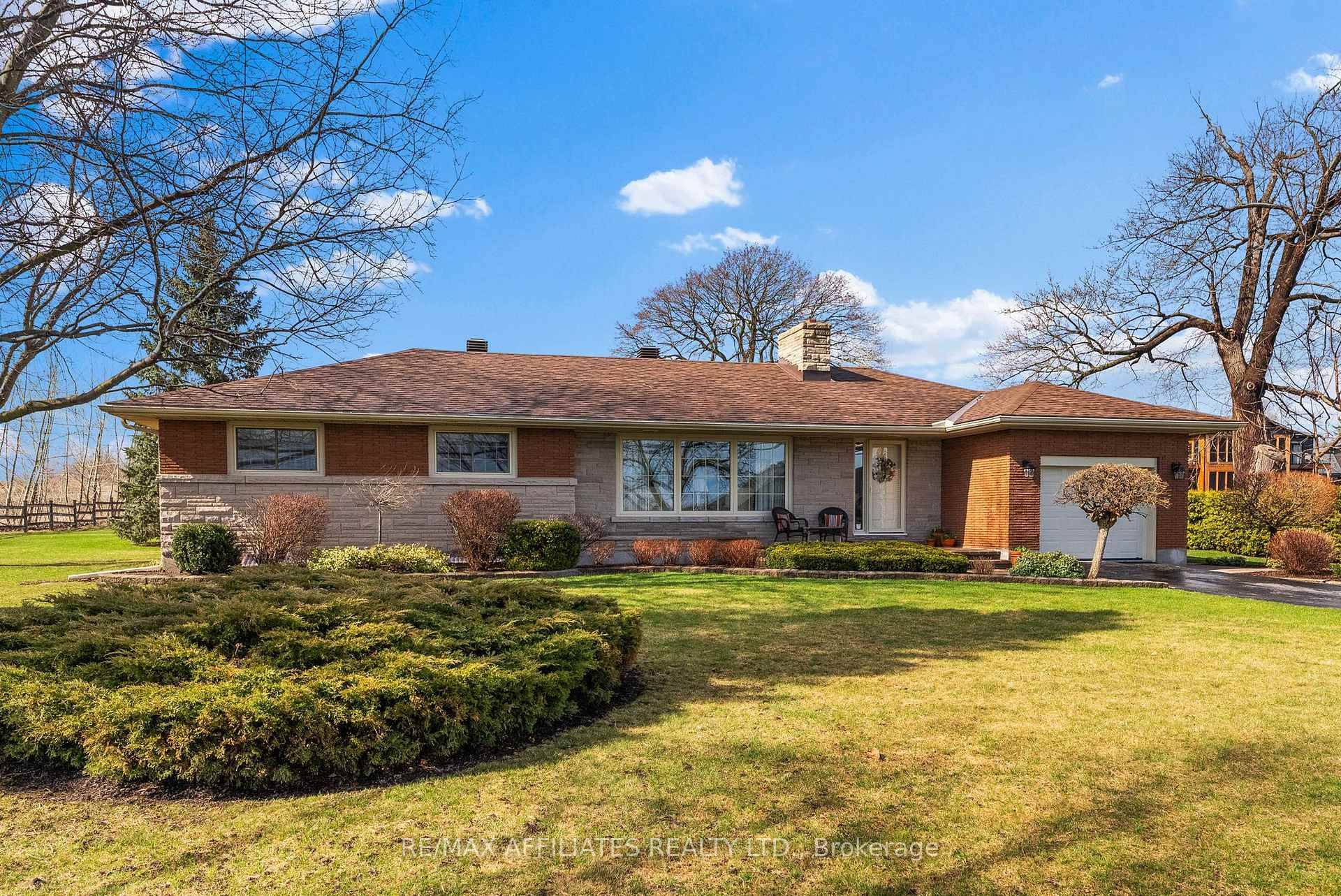 Impeccably maintained amp ; tastefully updated, this charming single owner bungalow boasts unfettered views of the St.