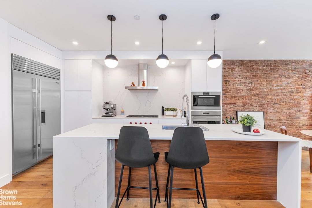Full floor loft living meets modern luxury in this impeccably renovated two bedroom, two bathroom residence just off Union Square.