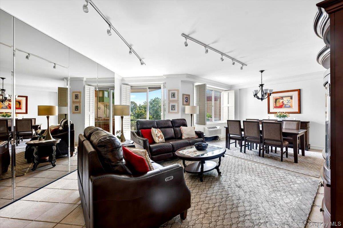 Welcome to the highly sought after Wyndham East in Garden City, offering luxury living with exceptional amenities including a doorman, indoor pool, sauna, gym, and valet service.