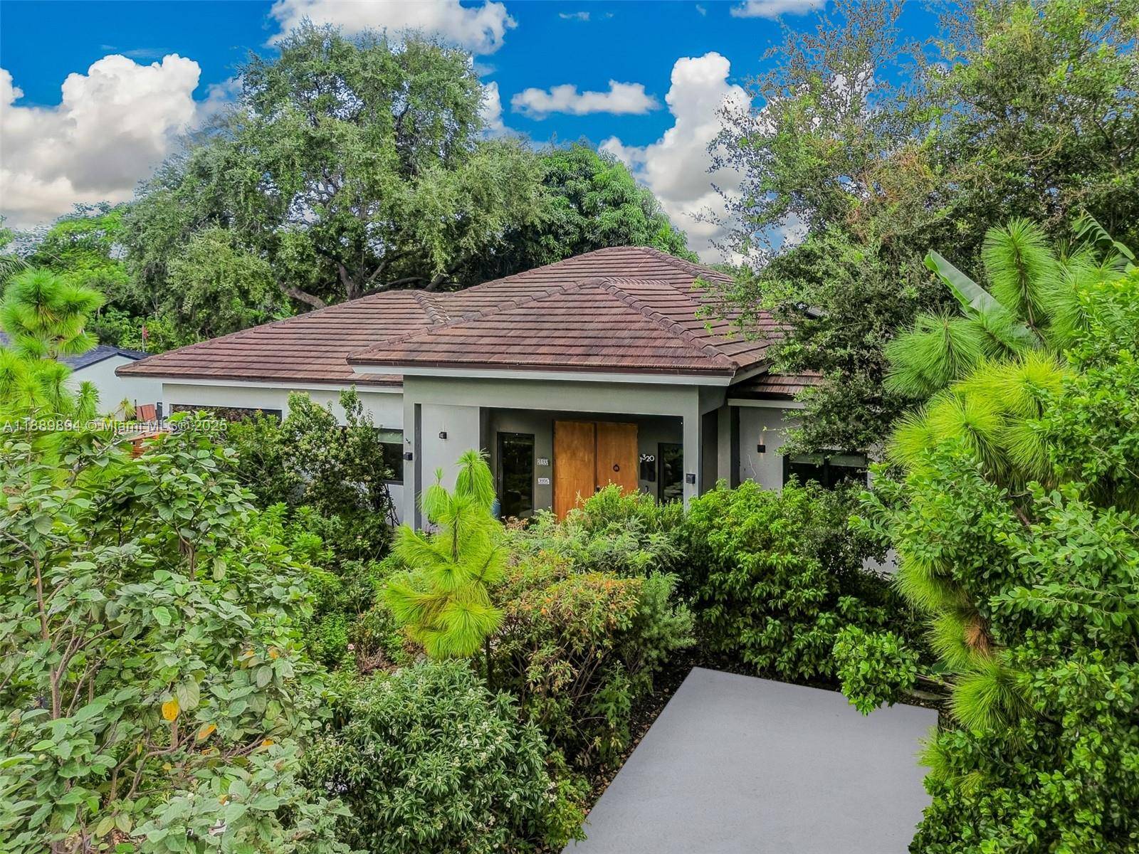 A Modern Tropical Paradise in Quiet North Miami Neighborhood, Just 2 Blocks from Enchanted Forest.