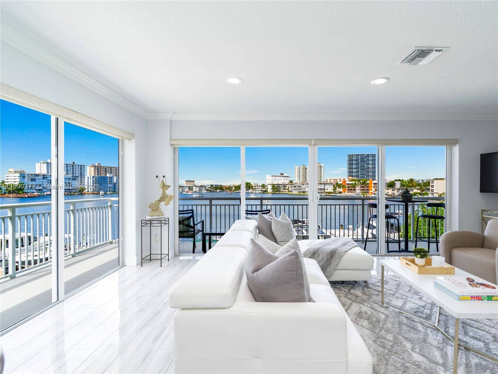 Beautiful fully furnished 2 bedroom, 2 bath corner residence with unobstructed, breathtaking water views from every room, offering direct access to the Intracoastal Waterway, perfect for boating, kayaking, or paddleboarding.