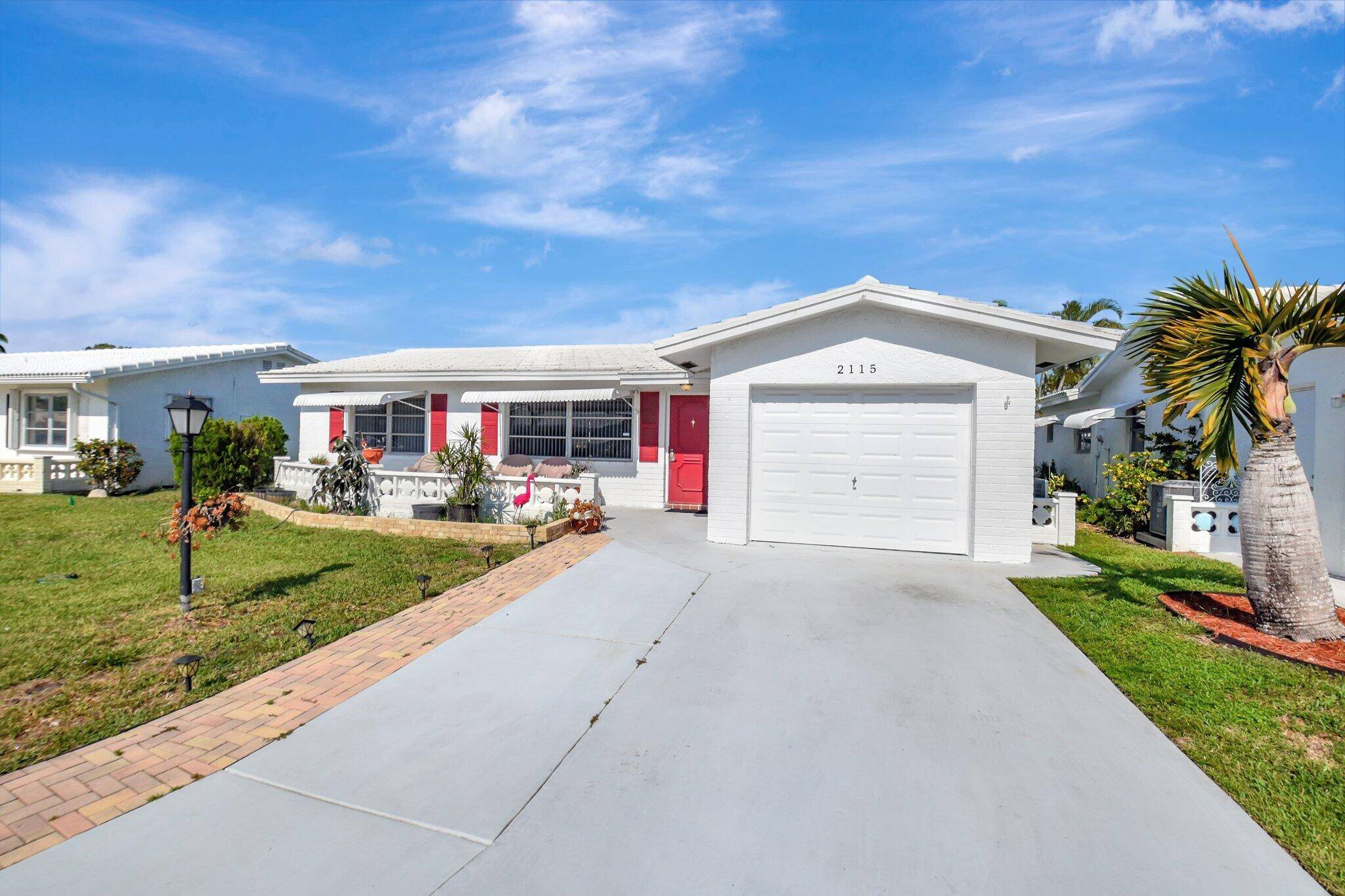 Beautifully updated 2BR 2BA single family home with 1 car garage in sought after Palm Beach Leisureville, a lively 55 community.