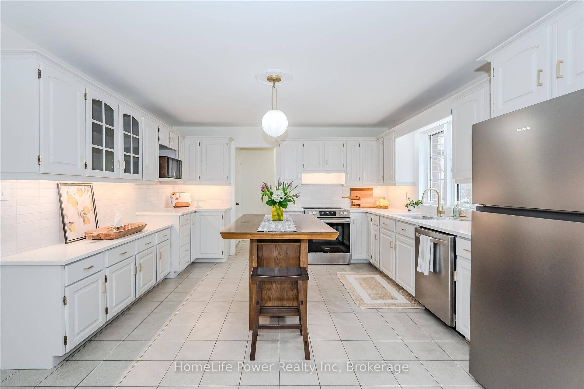 Tucked away in the serene countryside of Puslinch, this timeless all brick bungalow sits on just over 2 beautifully landscaped acres, bordered by a charming babbling creek.