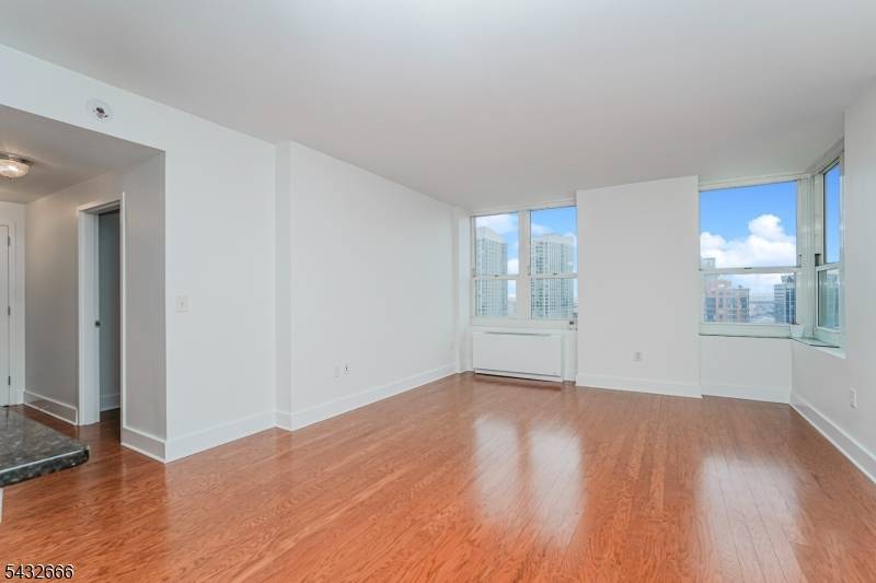 Perched on the 37th floor of one of Jersey City's premier waterfront residences, this stunning 843 sqft corner unit condominium at 88 Morgan Street offers breathtaking unobstructed views of the ...