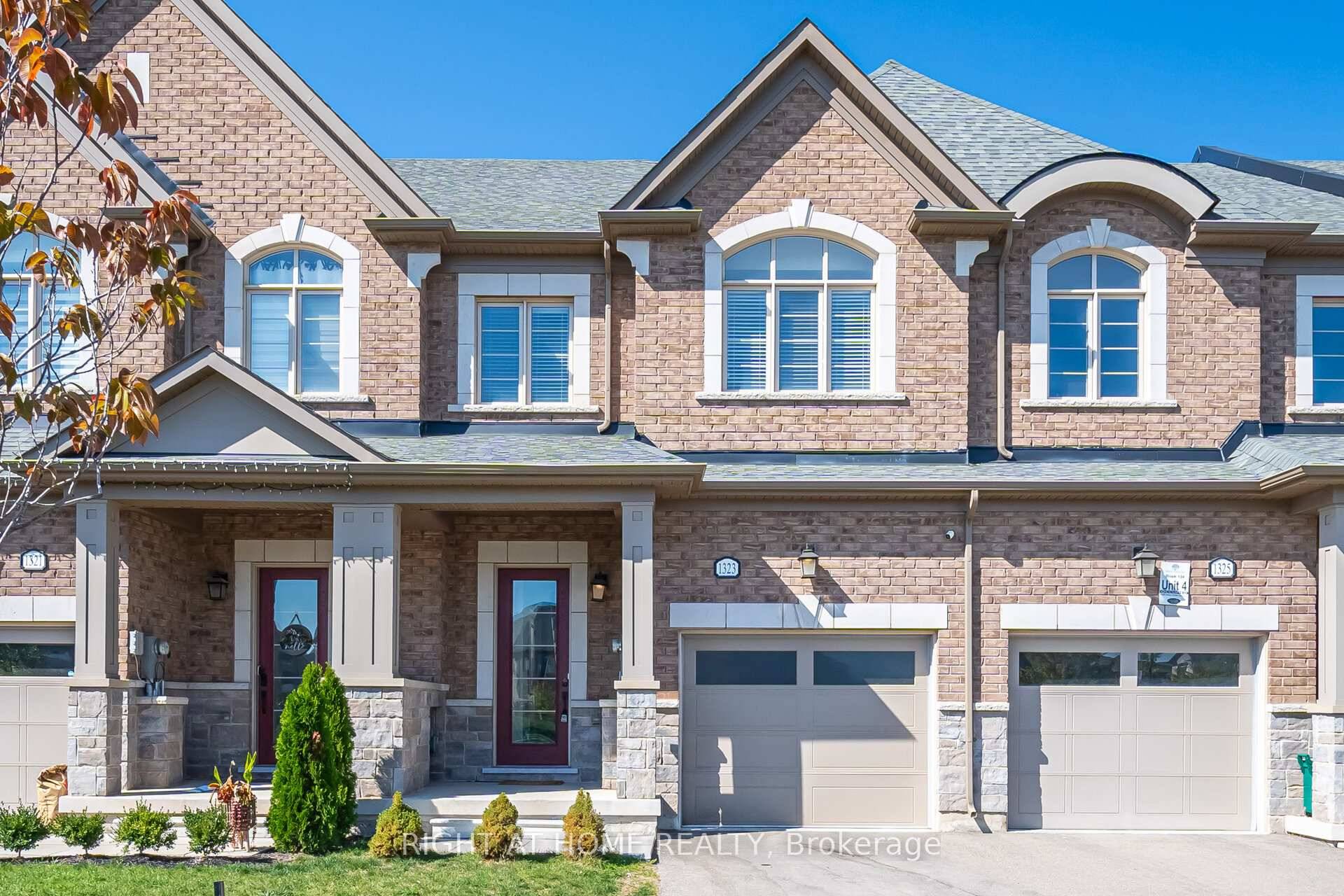 Beautifully upgraded, park facing 2 storey townhouse on a deep lot with no sidewalk, offering extra parking and excellent curb appeal !